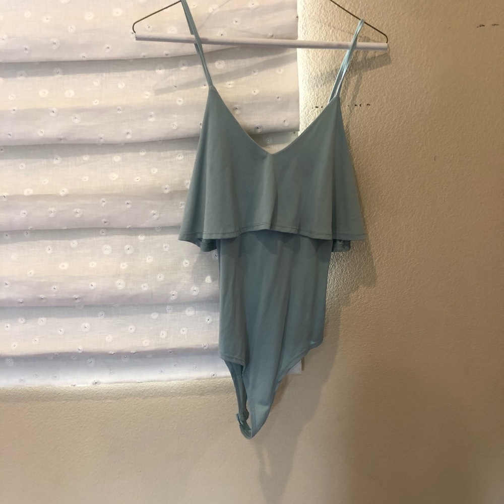 Teal body suit